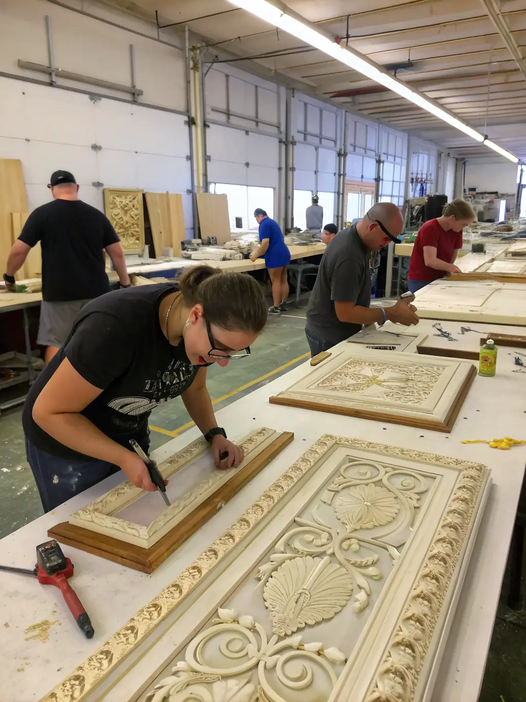 A group of volunteers working on restoring a vintage train car, highlighting the dedication and passion behind the railway's preservation efforts.